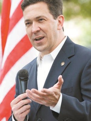 State Sen. Chris McDaniel, R-Ellisville, speaks before a crowd of partisan supporters gathered on the south lawns of the Mississippi State Capitol in Jackson, Miss., as part of the Tea Party Express that bused into the state Thursday, April 24, 2014, promoting their theme of fighting for liberty and constitutional conservatism. McDaniel, is running against incumbent U.S. Sen. Thad Cochran, R-Miss. The Tea Party Express are holding events in 10 states as they seek to rally voters around candidates the Tea Party is backing in contested Senate and House races. (AP Photo/Rogelio V. Solis)