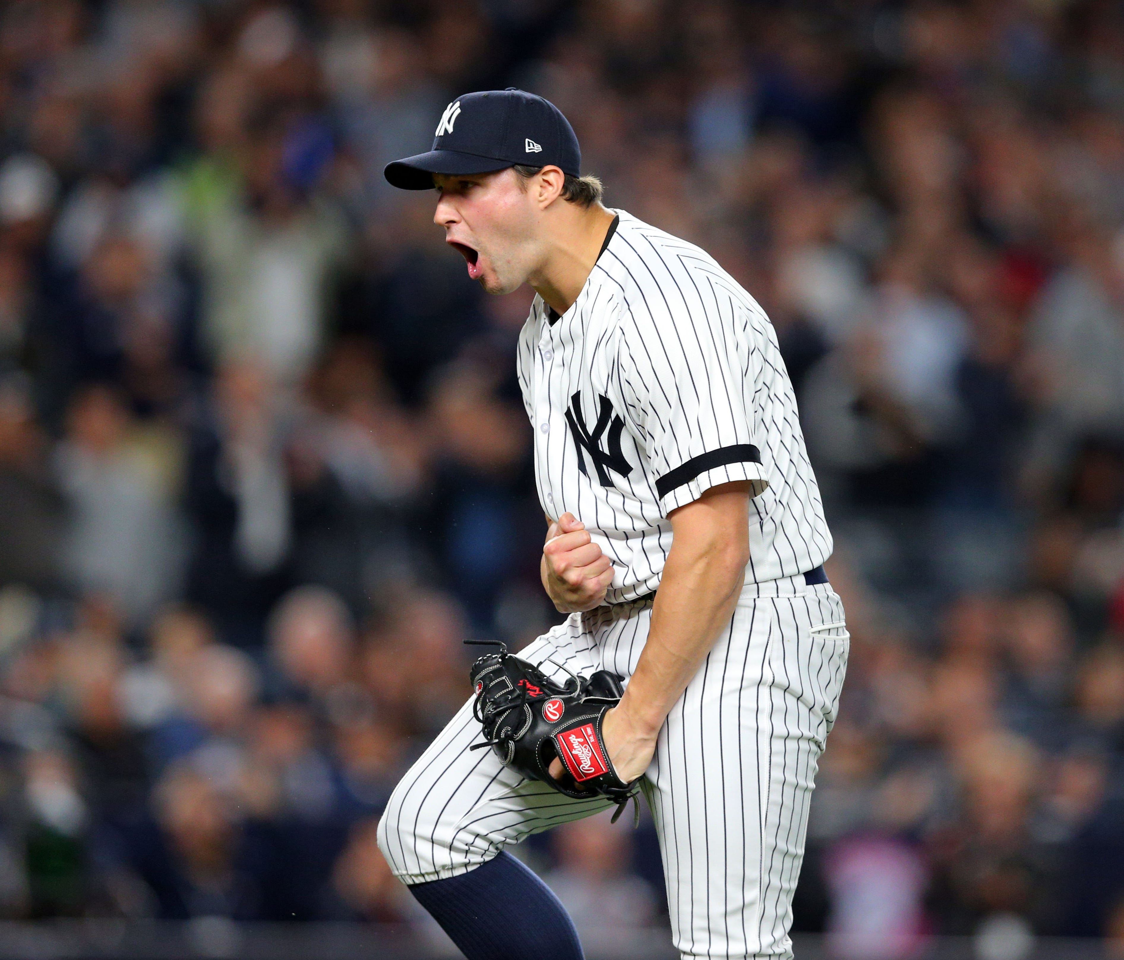 Tommy Kahnle exults after recording one of the Yankee bullpen's record-tying 13 strikeouts in Tuesday's wild-card game.