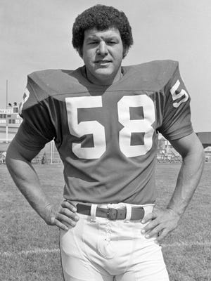 Minnesota Vikings linebacker Wally Hilgenberg is shown on Aug. 6, 1973. His wife, Mary, has been a widow for nine years, having lost Wally to a debilitating disease brought on by his hard-hitting career in the NFL with the Vikings. Now her role is to support other wives of ailing former players, with a mission to keep as many kids away from the sport as she can.