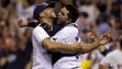 Tampa Bay closer David Price, left, is hugged by catcher
