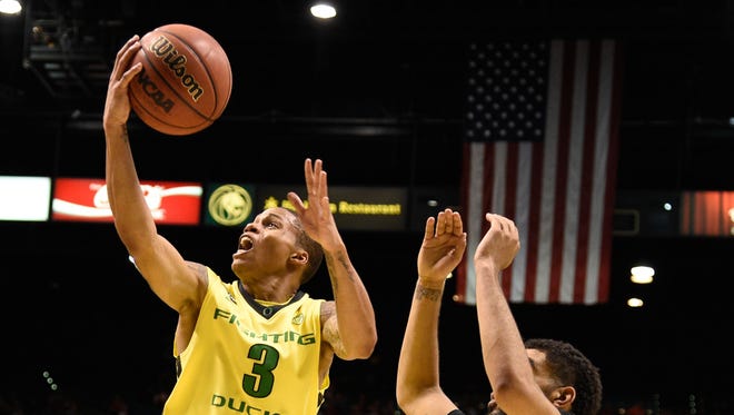 March 12, 2015; Las Vegas, NV, USA; Oregon Ducks guard Joseph Young (3) shoots the basketball against Colorado Buffaloes forward Josh Scott (40) during the second half in the quarterfinal round of the Pac-12 Conference tournament at MGM Grand Garden Arena. The Ducks defeated the Buffaloes 93-85. Mandatory Credit: Kyle Terada-USA TODAY Sports