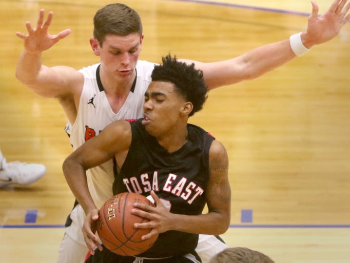 Wauwatosa East's Elijah Flenorl battles Ripon's Ben