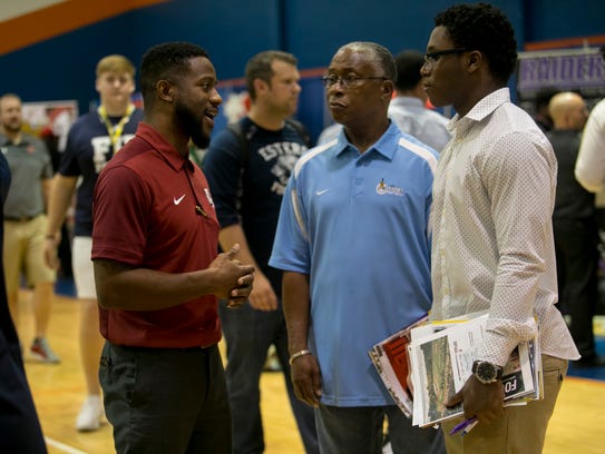 Alex Suber of Lyon College talks with Rickey Anderson