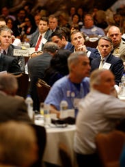 Missouri Gov. Eric Greitens listens to a speaker during