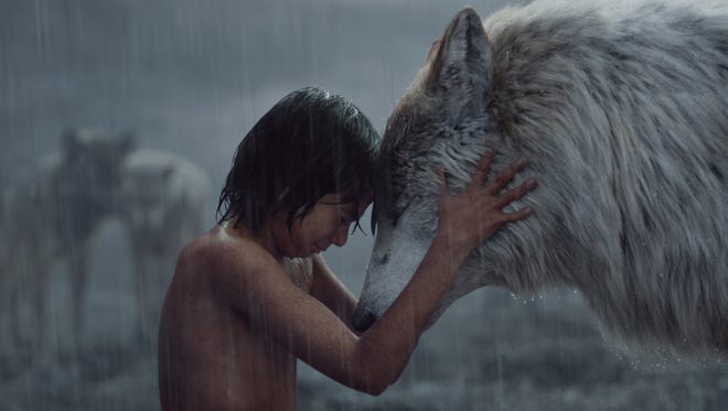 Mowgli (Neel Sethi) shares a moment with his wolf mom Raksha (voiced by Lupita Nyong'o).