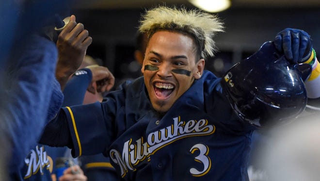 Brewers shortstop Orlando Arcia celebrates with his teammates after hitting a solo home run in the sixth inning.