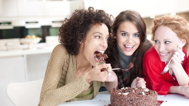 Friends eating chocolate cake
