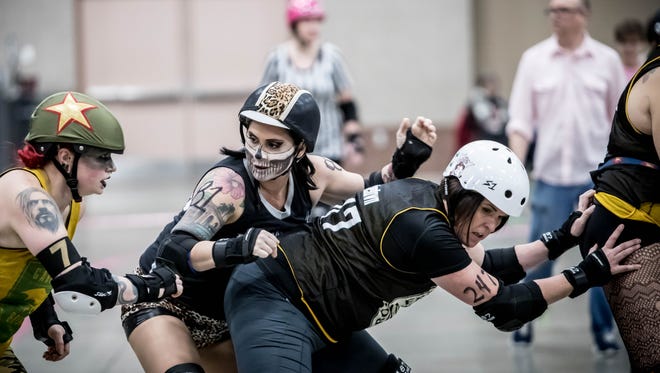 The St. Cloud Area Roller Dolls take on The Dirty Ores from Eveleth on Saturday at River's Edge Convention Center.