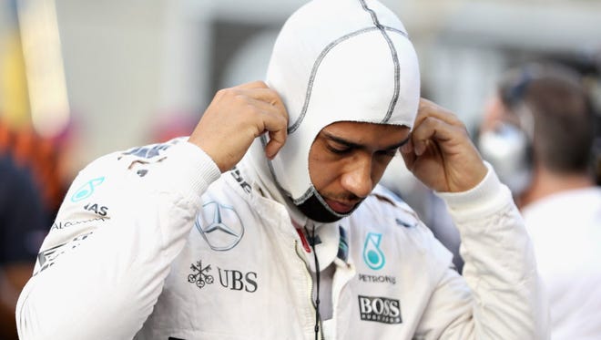 Lewis Hamilton prepares for the race on the grid  during the Abu Dhabi Grand Prix.