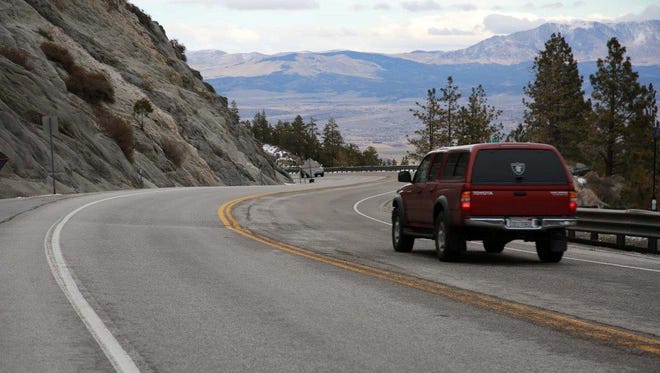 A submitted photo showing a red truck driving on Kingsbury Grade. A sinkhole prompted officials with the Nevada Department of Transportation to close a portion of the roadway. It was not known when it would reopen because of the recent winter weather.