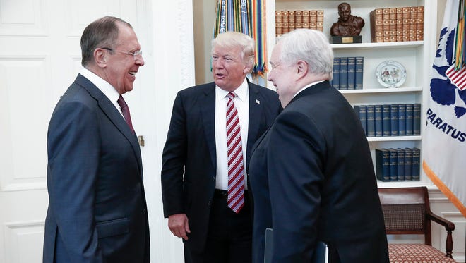 This file handout photo taken on May 10, 2017 made available by the Russian Foreign Ministry shows shows President Trump speaking with Russian Foreign Minister Sergey Lavrov and Russian ambassador Sergey Kislyak during a meeting at the White House.