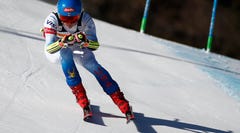 United States' Mikaela Shiffrin speeds down the course of an alpine ski, women's World Cup super-G race in Cortina d'Ampezzo, Italy, Sunday, Jan. 23, 2022. (AP Photo/Gabriele Facciotti)