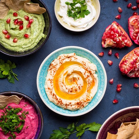 Colorful hummus bowls. Different kinds of dips....
