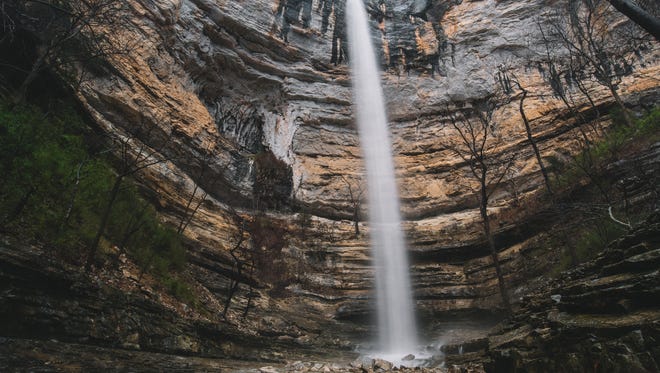 Professional photographer Colby Moore captured this image of Hemmed-in-Hollow waterfall  when the 210-foot waterfall was flowing at its peak.