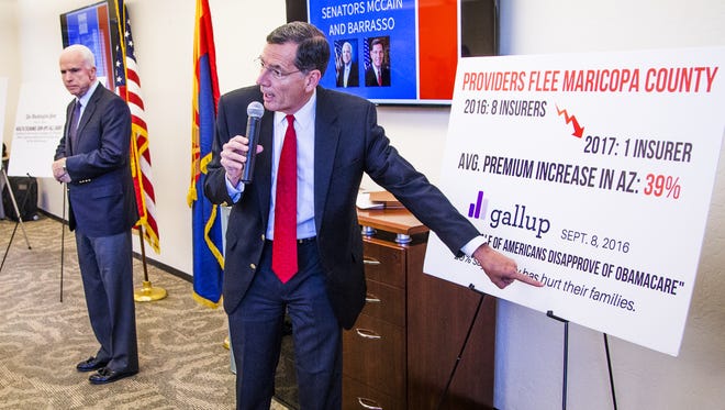 Arizona voters' feelings about the Affordable Care Act remain sharply divided, a new poll shows. Here, Sen. John Barrasso of Wyoming conducts a town hall on "Obamacare" at the Phoenix Better Business Bureau in September 2016.