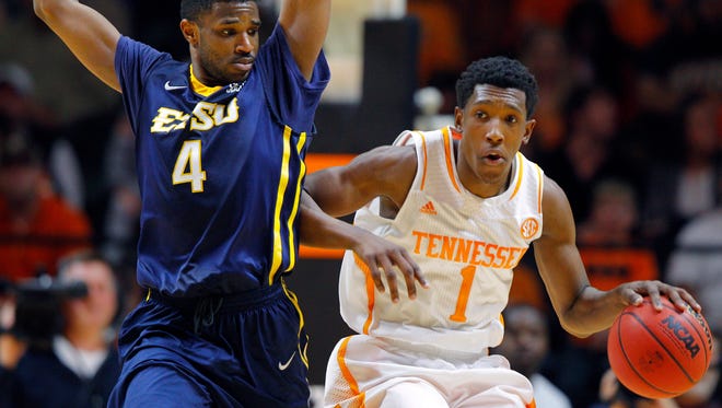 Tennessee guard Josh Richardson dribbles against East Tennessee State guard Rashawn Rembert during a game at Thompson-Boling Arena on Wednesday, Dec. 31, 2014. Tennessee won 71-61.