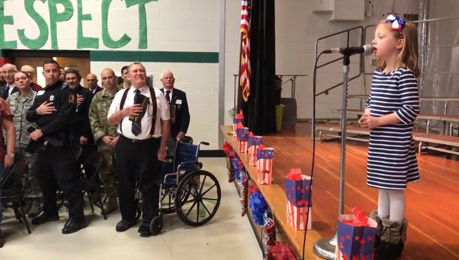 Avon first-grader Quinn Kenyon sang the national anthem to about 40 veterans at her school's Veterans Day assembly.