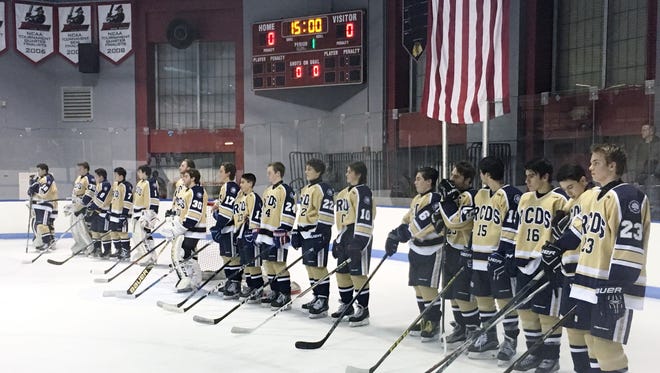 RCDS hockey stands for pregame ceremony prior to Wednesday's game against Rye.