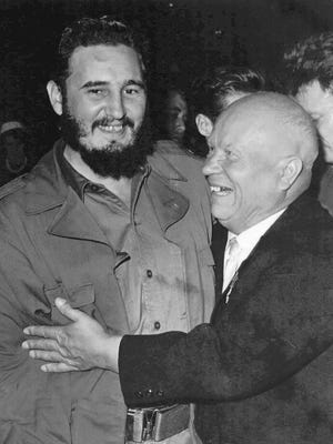 Cuban leader Fidel Castro, left, is hugged by Soviet Premier Nikita S. Khrushchev on the floor of the United Nations General Assemby in this September 1960 file photo.