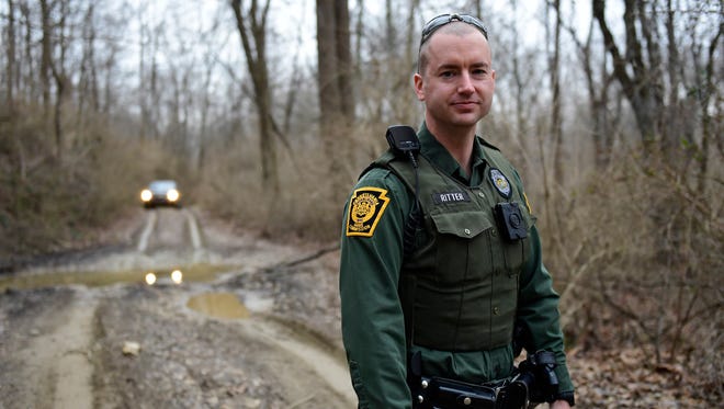 Justin Ritter investigates a possible off-roading call at State Game Lands 416 on Tuesday, March 6, 2018. Ritter, a game warden, said he knows his job is dangerous but he loves it anyway.