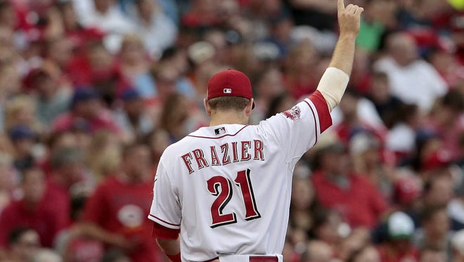 Cincinnati Reds third baseman Todd Frazier (21) signals one out during the top of the third inning of the MLB game between the Cincinnati Reds and the Milwaukee Brewers at Great American Ballpark in Cincinnati on Friday, July 3, 2015.