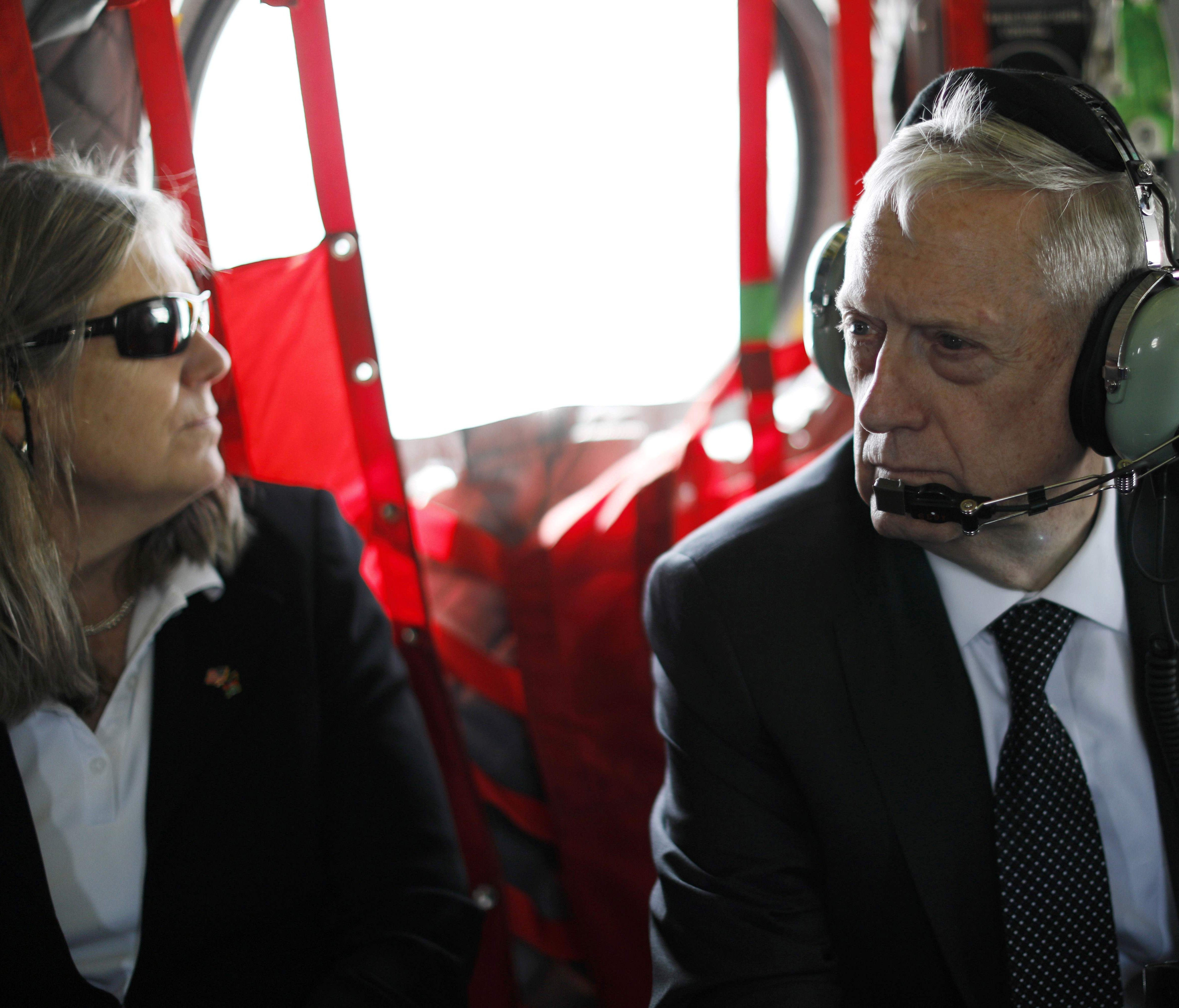 Defence Secretary Jim Mattis and senior adviser Sally Donnelly arrive by helicopter at Resolute Support headquarters in the Afghan capital Kabul on April 24, 2017.