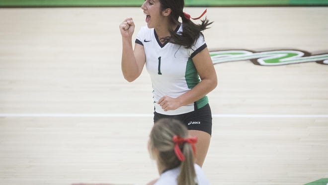FILE -- Former Yorktown volleyball star Kate Avila celebrates during a match during her high school career with the Tigers. She is now a senior at Ball State.