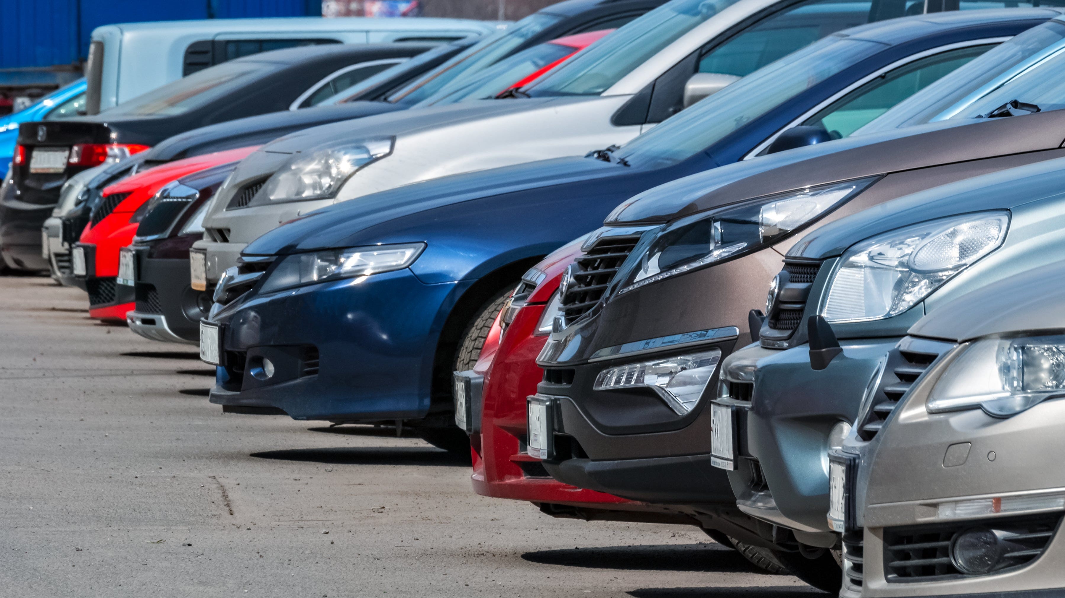 row of cars at a dealership