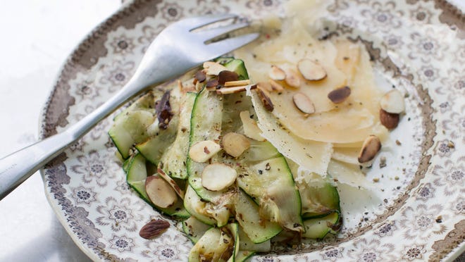 
Grilled zucchini ribbons with Parmesan and toasted almonds. The grilled zucchini ribbons add both flavor and visual appeal to many dishes.

