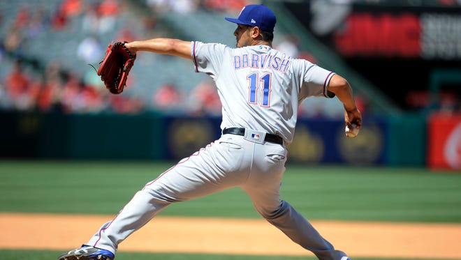 Texas Rangers starting pitcher Yu Darvish (11) throws in the fourth inning against the Los Angeles Angels at Angel Stadium of Anaheim.