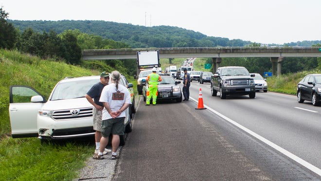 Traffic slows down at the scene of an accident where a driver struck a black bear on the side of I-81 near Weyers Cave on Thursday, June 25, 2015.