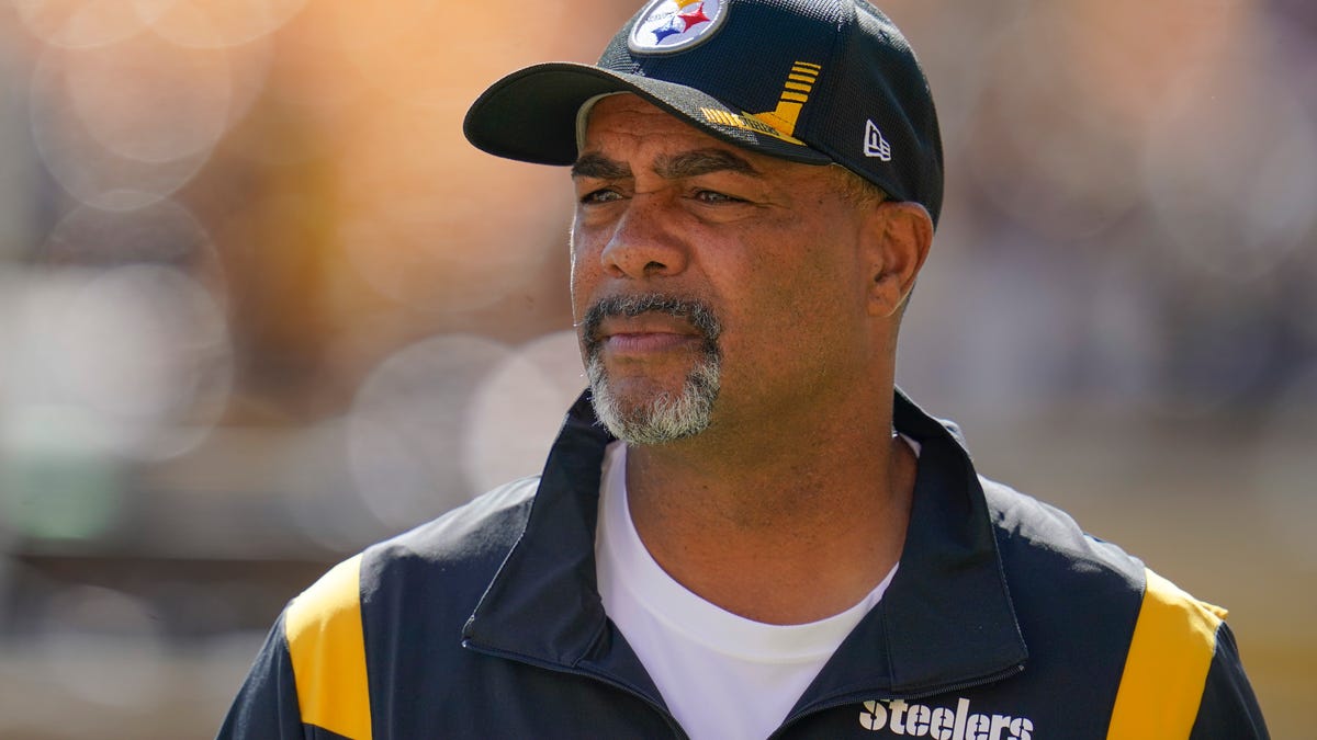 FILE - Pittsburgh Steelers senior defensive assistant coach Teryl Austin watches the team warm up before an NFL football game against the Cincinnati Bengals, Sunday, Sept. 26, 2021, in Pittsburgh. Teryl Austin has been where Brian Flores currently is many times. Eleven to be exact. That's the number of head coaching interviews the Pittsburgh Steelers senior defensive assistant has had through the years, some of which made   Austin feel as if he was only there to check a box. (AP Photo/Gene J. Puskar, File)