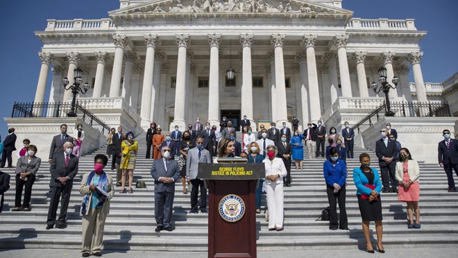 House Speaker Nancy Pelosi of Calif., joined by House Democrats spaced for social distancing, speaks during a news conference on the House East Front Steps on Capitol Hill in Washington, Thursday, June 25, 2020, ahead of the House vote on the George Floyd Justice in Policing Act of 2020.