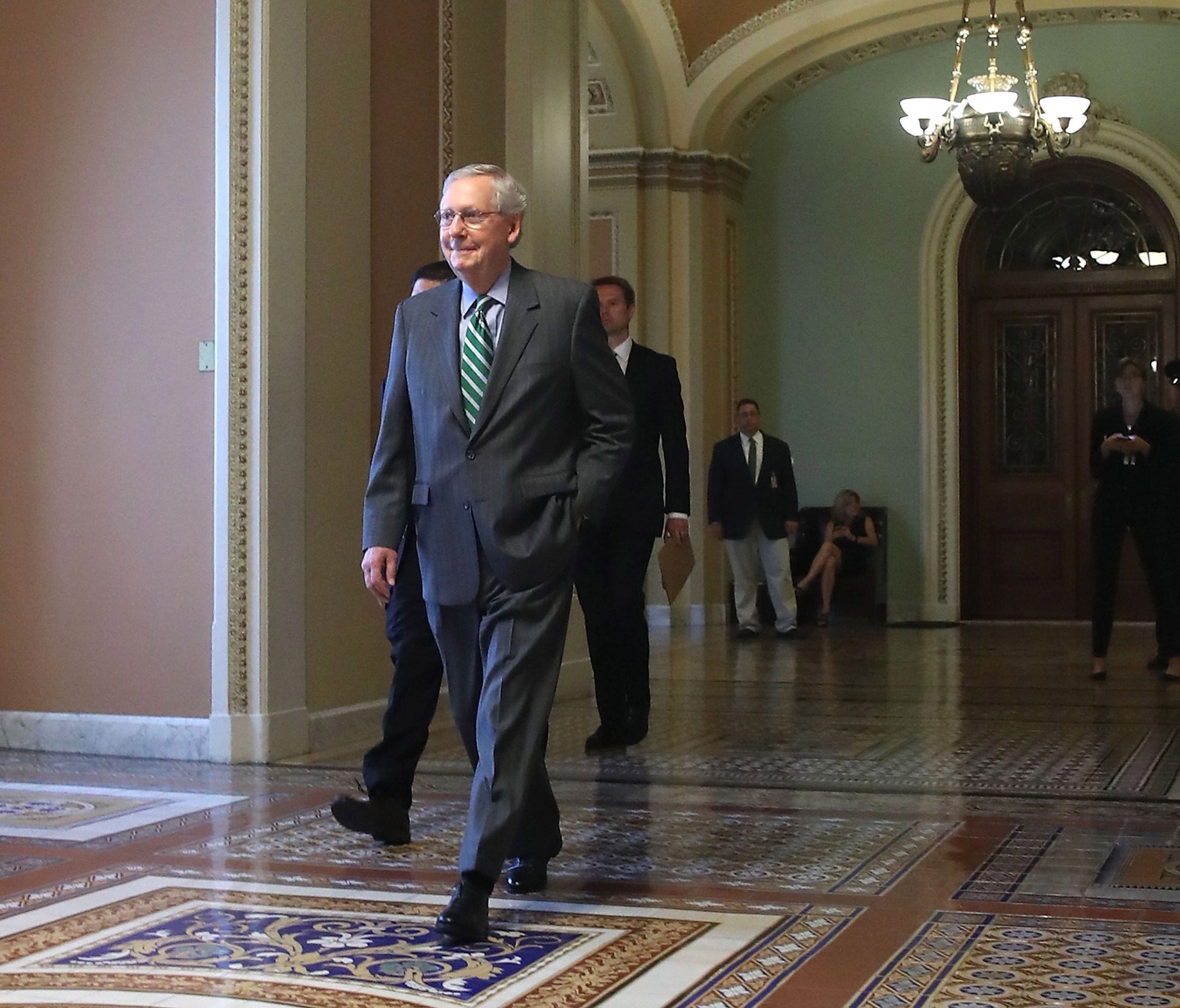Senate Majority Leader Mitch McConnell (R-KY) walks to his office on Capitol Hill on June 22, 2017 before Senate Republicans released their version of the House-passed health care bill.
