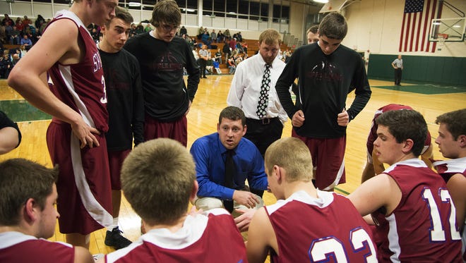 Spaulding head coach Jesse Willard talks to his team during a timeout in the boys basketball game against Rice Memorial High School on Friday night.