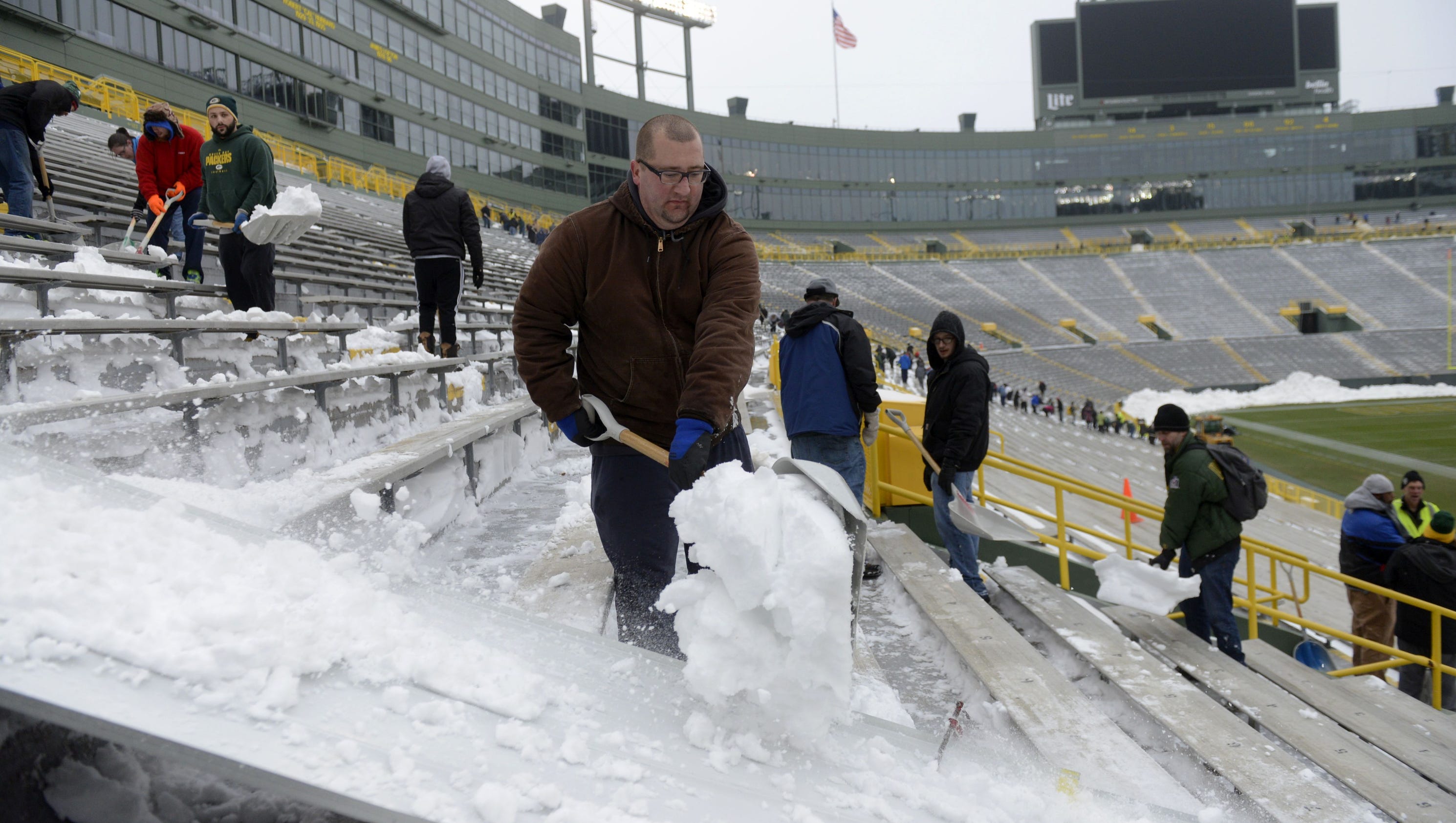 Snow Packer Hundreds Turn Out To Shovel Snow At Lambeau Field