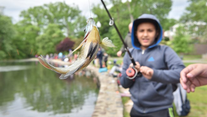 Marco Faltes, 9, catches a fish at The Parks & Recreation Trout Fishing Contest in Nutley in May.