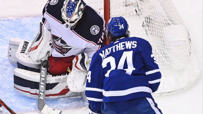 Joonas Korpisalo (70) stopped this shot by Maple Leafs star Auston Matthews (34) to keep it 0-0 in the second period and made 28 saves in a 2-0 shutout victory that put the Blue Jackets up 1-0 in a five-game series to open the playoffs.