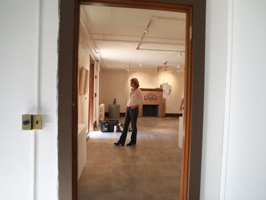 Art is being installed for the upcoming art exhibit