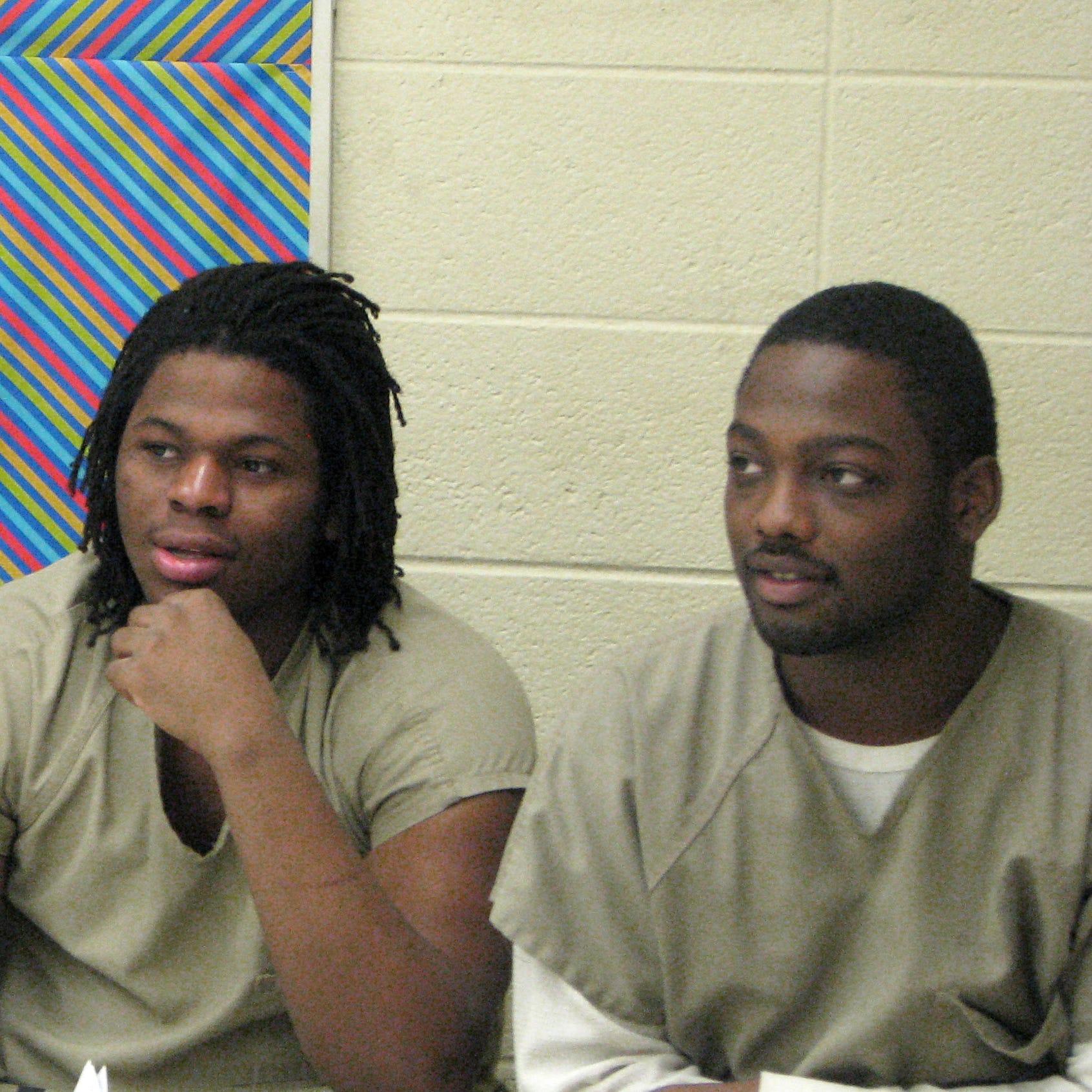 From left, Xavier Tate, Aurelius Canada and Romell Young listen to their instructor during a job interview exercise at the Cook County Jail in Chicago. The men are participants in the S.A.V.E. program, which includes intensive behavioral therapy and 