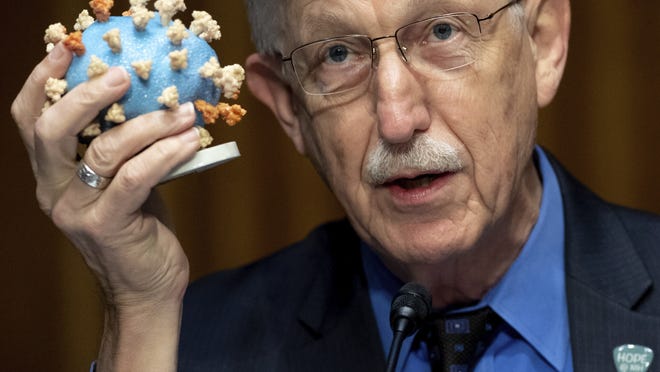 Dr. Francis Collins, director of the National Institutes of Health (NIH), holds up a model of COVID-19, known as coronavirus, during a Senate Appropriations subcommittee hearing on the plan to research, manufacture and distribute a coronavirus vaccine, known as Operation Warp Speed, Thursday, July 2, 2020, on Capitol Hill in Washington.