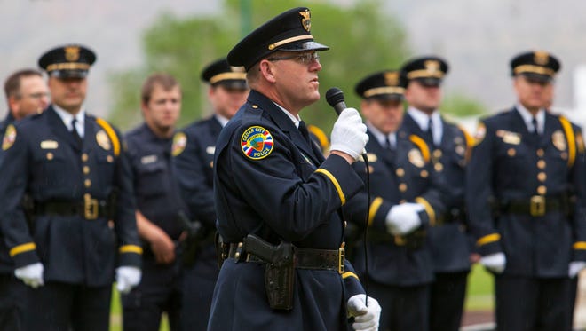 Cedar City Police Chief Darin Adams speaks during a flag raising ceremony at the Cedar City Cemetery to mark National Police Week, May 17, 2017.