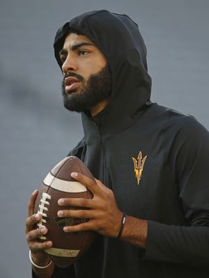 ASU's Manny Wilkins (5) warms up before the game at Sun Devil Stadium in Tempe, Ariz. on August 31, 2017.