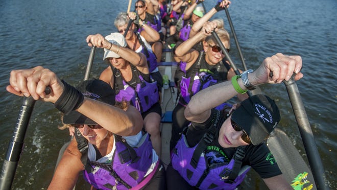 The River Sisters Dragon Boat Team, a team made up of female cancer survivors, practice on the Cooper River as they prepare to compete in the Cooper River Dragon Boat Festival on July 18.