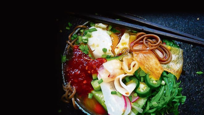 Naengmyeon is exceptional served cold. Don't heat it up!