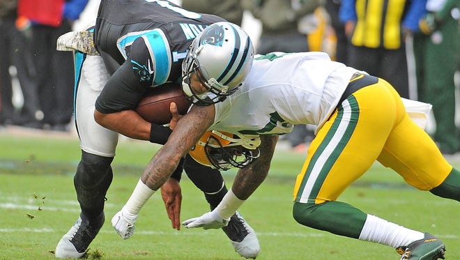 Green Bay Packers free safety Ha Ha Clinton-Dix (21) tackles Carolina Panthers quarterback Cam Newton (1) at Bank of America Stadium on Nov. 8, 2015.