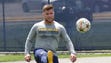 Michigan fullback Joe Beneducci kicks a soccer ball