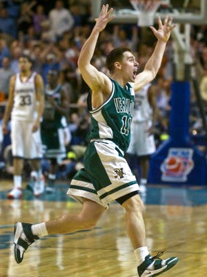 Vermont's T.J. Sorrentine celebrates Vermont's 60-57 overtime victory over Syracuse in the first round of the NCAA Tournament at the DCU Center in Worcester, Mass. on Friday, March 18, 2005.
