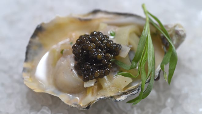 
At the July 26 Mirepoix USA luxury foods dinner at the Wilbur D. May Center in Rancho San Rafael Regional Park, Morro Bay oysters are being topped with hillocks of costly caviar from the Russian sturgeon breed of the fish. The dinner features five courses with wines paired by Southern Wine & Spirits.
