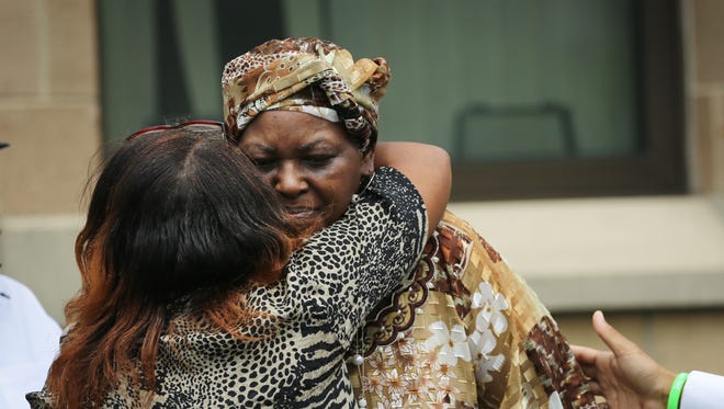 Audrey DuBose, the mother of Samuel DuBose, gets a hug after her son's funeral Tuesday.